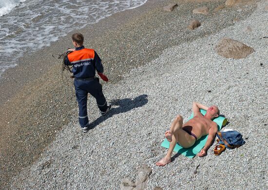 Diver examinsation and bottom cleansing off Crimean beach shore