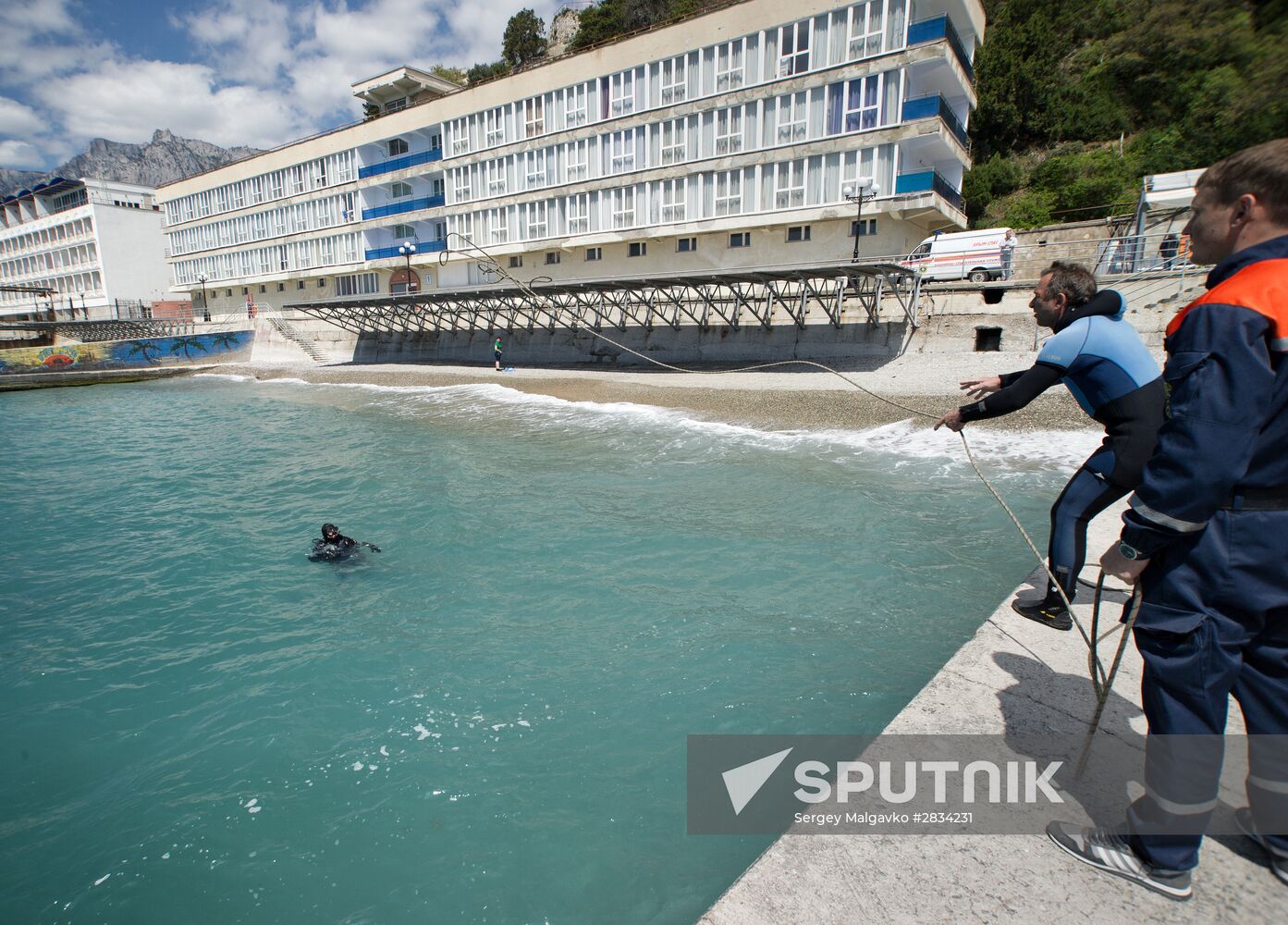 Diver examinsation and bottom cleansing off Crimean beach shore