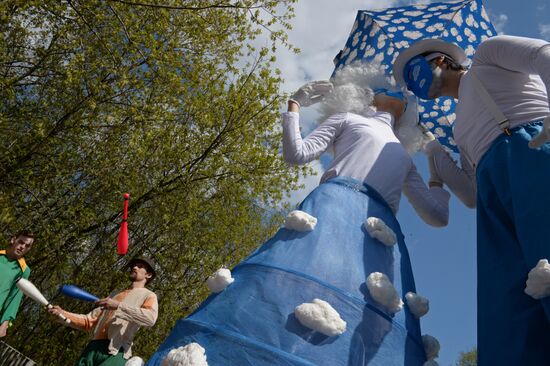 Stiltwalkers march at Between the Earth and Sky festival