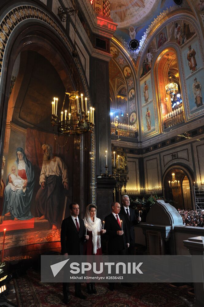 Russian President Vladimir Putin and Russian Prime Minister Dmitry Medvedev attend Easter service at Christ the Savior Cathedral in Moscow