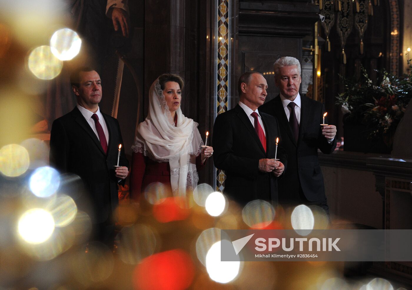 Russian President Vladimir Putin and Russian Prime Minister Dmitry Medvedev attend Easter service at Christ the Savior Cathedral in Moscow