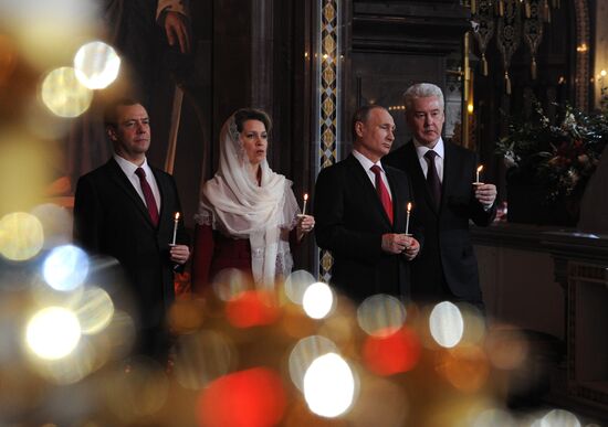 Russian President Vladimir Putin and Russian Prime Minister Dmitry Medvedev attend Easter service at Christ the Savior Cathedral in Moscow