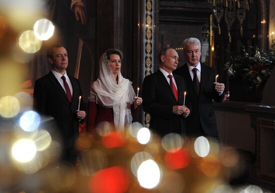 Russian President Vladimir Putin and Russian Prime Minister Dmitry Medvedev attend Easter service at Christ the Savior Cathedral in Moscow