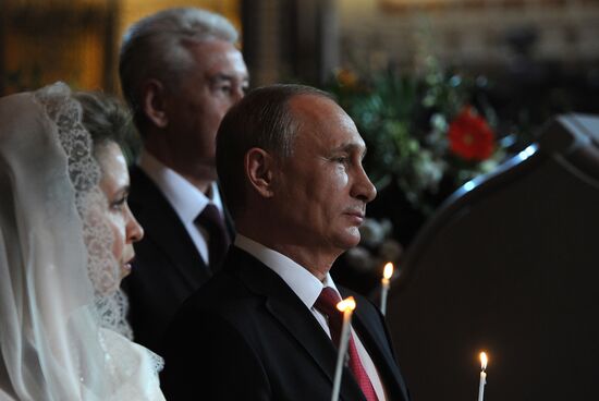 Russian President Vladimir Putin and Russian Prime Minister Dmitry Medvedev attend Easter service at Christ the Savior Cathedral in Moscow