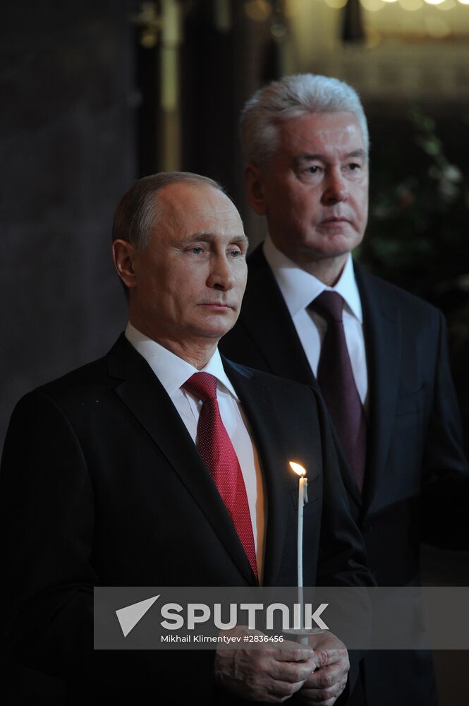 Russian President Vladimir Putin and Russian Prime Minister Dmitry Medvedev attend Easter service at Christ the Savior Cathedral in Moscow