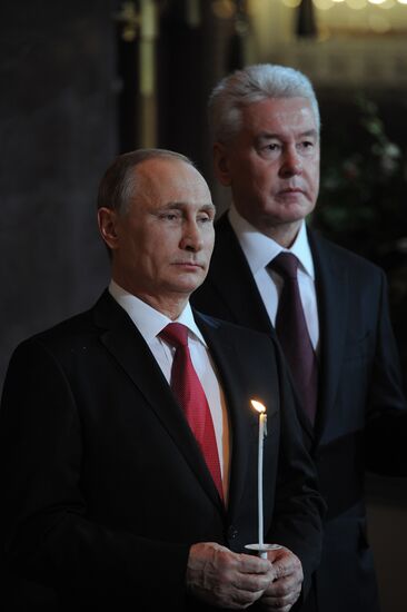 Russian President Vladimir Putin and Russian Prime Minister Dmitry Medvedev attend Easter service at Christ the Savior Cathedral in Moscow
