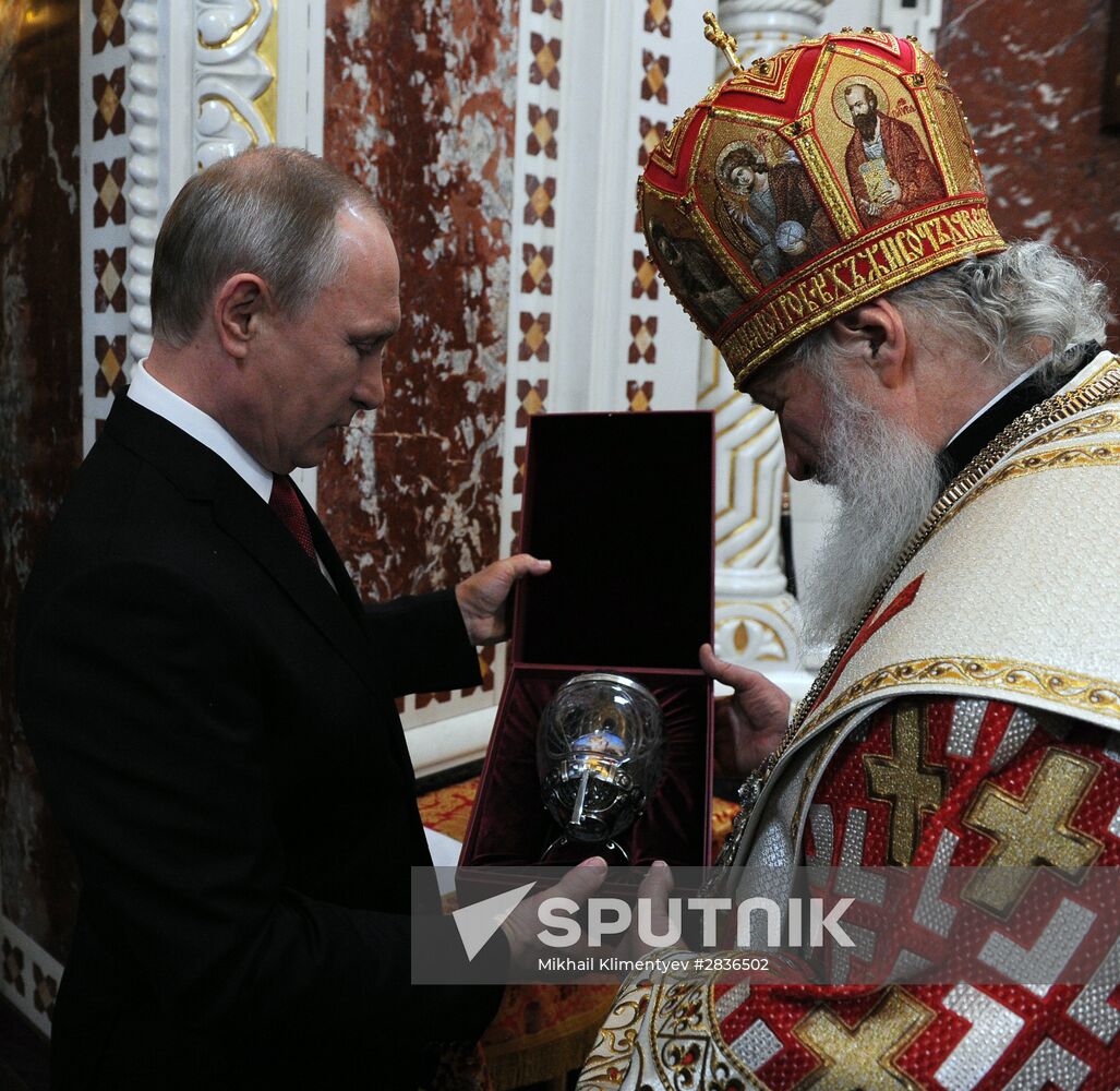 Russian President Vladimir Putin and Russian Prime Minister Dmitry Medvedev attend Easter service at Christ the Savior Cathedral in Moscow
