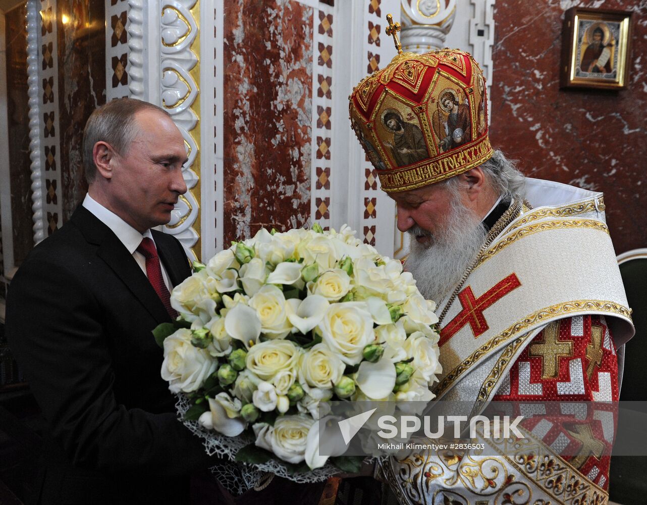 Russian President Vladimir Putin and Russian Prime Minister Dmitry Medvedev attend Easter service at Christ the Savior Cathedral in Moscow