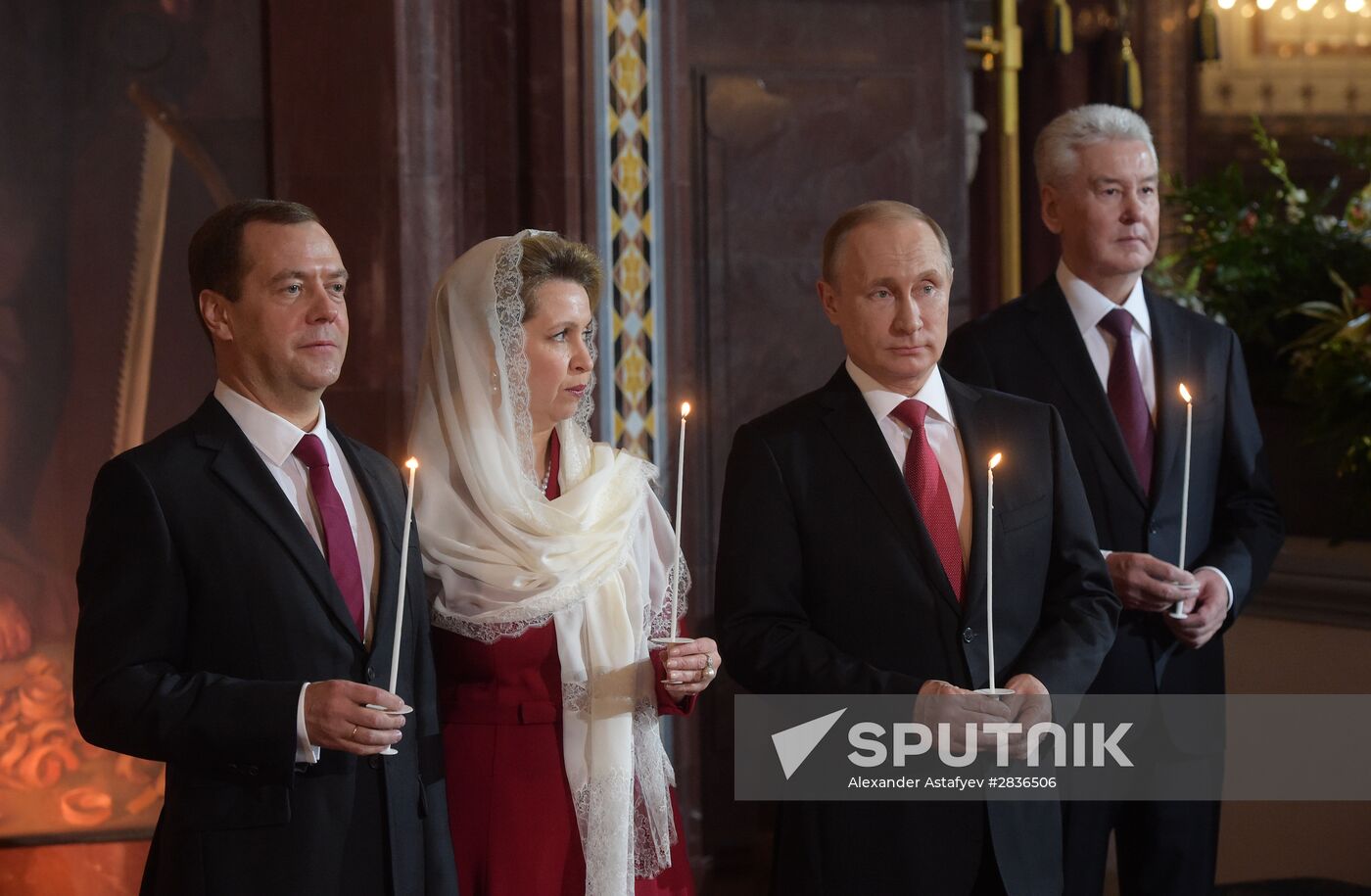 Russian President Vladimir Putin and Russian Prime Minister Dmitry Medvedev attend Easter service at Christ the Savior Cathedral in Moscow