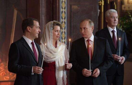 Russian President Vladimir Putin and Russian Prime Minister Dmitry Medvedev attend Easter service at Christ the Savior Cathedral in Moscow