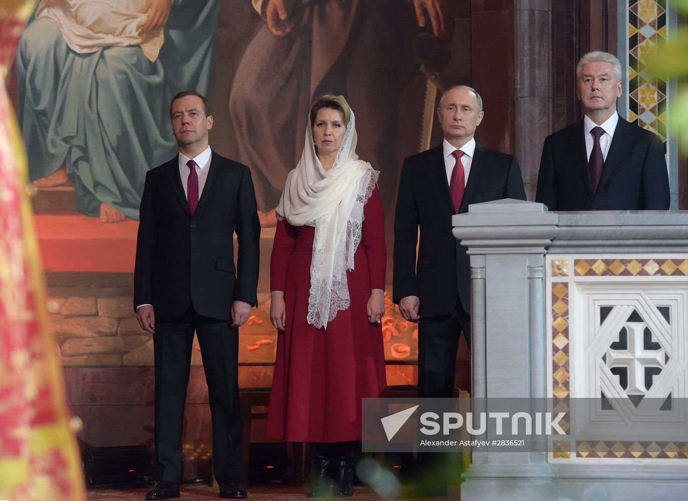 Russian President Vladimir Putin and Russian Prime Minister Dmitry Medvedev attend Easter service at Christ the Savior Cathedral in Moscow