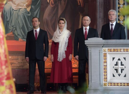 Russian President Vladimir Putin and Russian Prime Minister Dmitry Medvedev attend Easter service at Christ the Savior Cathedral in Moscow