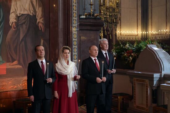 Russian President Vladimir Putin and Russian Prime Minister Dmitry Medvedev attend Easter service at Christ the Savior Cathedral in Moscow