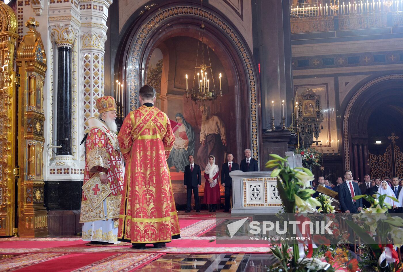 Russian President Vladimir Putin and Russian Prime Minister Dmitry Medvedev attend Easter service at Christ the Savior Cathedral in Moscow