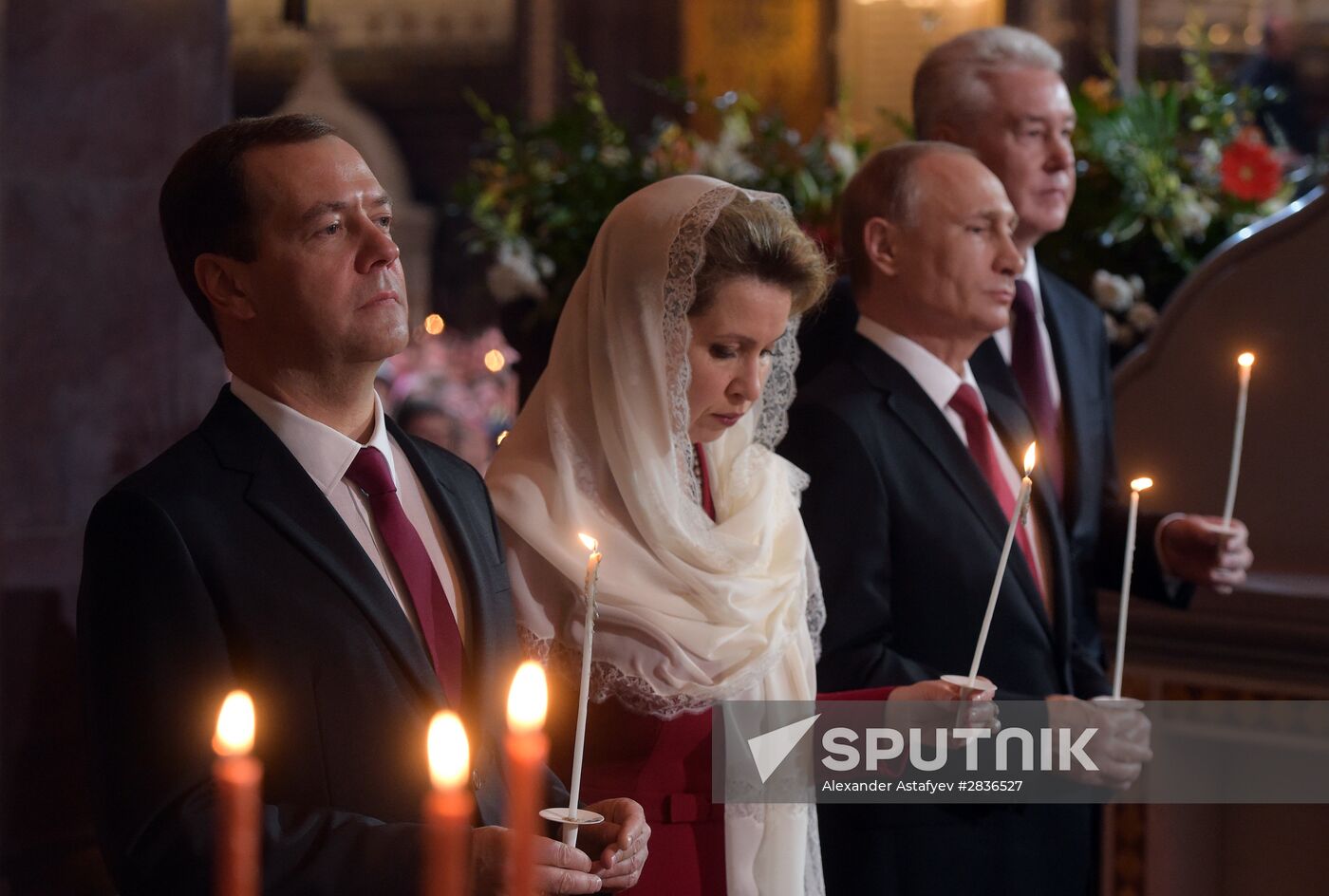 Russian President Vladimir Putin and Russian Prime Minister Dmitry Medvedev attend Easter service at Christ the Savior Cathedral in Moscow