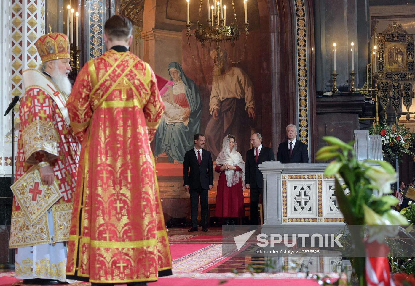 Russian President Vladimir Putin and Russian Prime Minister Dmitry Medvedev attend Easter service at Christ the Savior Cathedral in Moscow