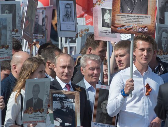 President Vladimir Putin takes part in Immortal Regiment march in Moscow