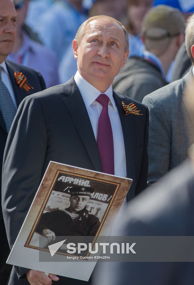 President Vladimir Putin takes part in Immortal Regiment march in Moscow
