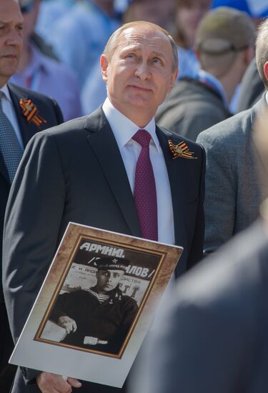 President Vladimir Putin takes part in Immortal Regiment march in Moscow