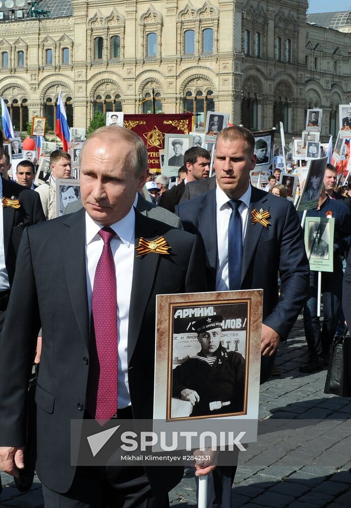 President Vladimir Putin takes part in Immortal Regiment march in Moscow