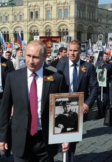 President Vladimir Putin takes part in Immortal Regiment march in Moscow