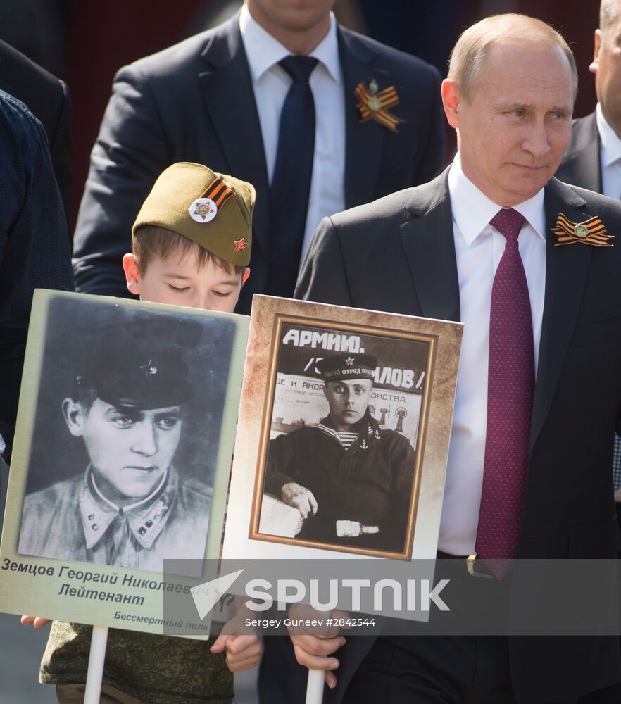 President Vladimir Putin takes part in Immortal Regiment march in Moscow