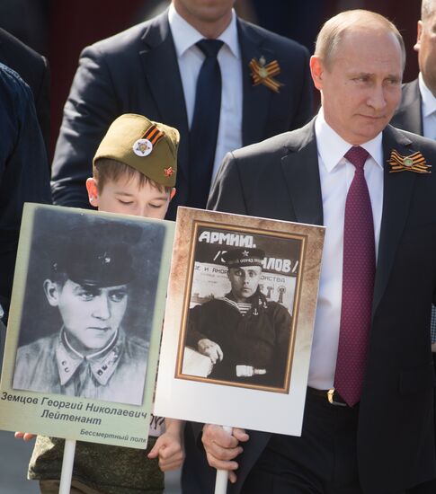 President Vladimir Putin takes part in Immortal Regiment march in Moscow