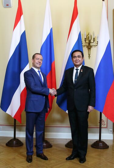 Russian Prime Minister Dmitry Medvedev meets with his Thai counterpart Prayut Chan-o-cha