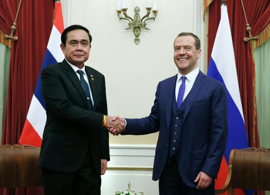 Russian Prime Minister Dmitry Medvedev meets with his Thai counterpart Prayut Chan-o-cha