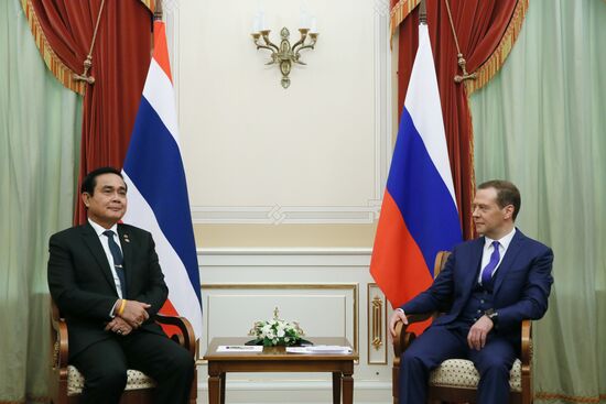 Russian Prime Minister Dmitry Medvedev meets with his Thai counterpart Prayut Chan-o-cha
