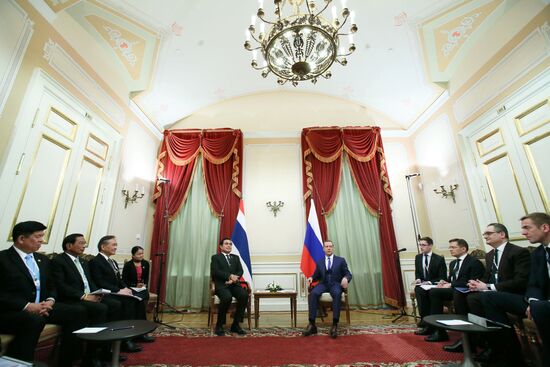 Russian Prime Minister Dmitry Medvedev meets with his Thai counterpart Prayut Chan-o-cha