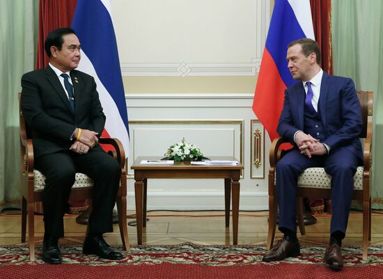 Russian Prime Minister Dmitry Medvedev meets with his Thai counterpart Prayut Chan-o-cha