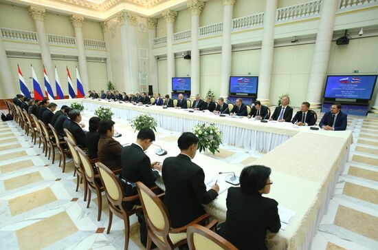 Russian Prime Minister Dmitry Medvedev meets with his Thai counterpart Prayut Chan-o-cha