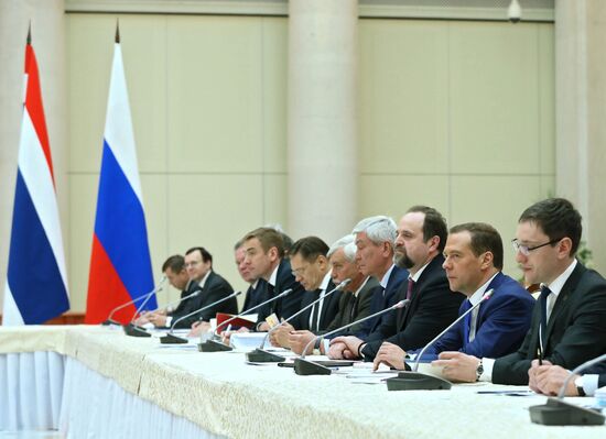 Russian Prime Minister Dmitry Medvedev meets with his Thai counterpart Prayut Chan-o-cha