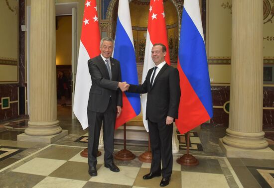 Russian Prime Minister Dmitry Medvedev meets with citizens at United Russia's Moscow reception office