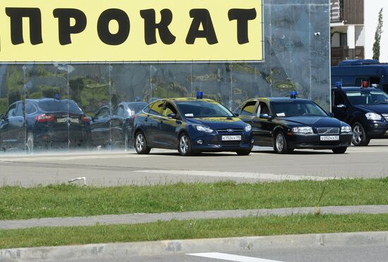 Cars with alarm light outside the congress center in Sochi