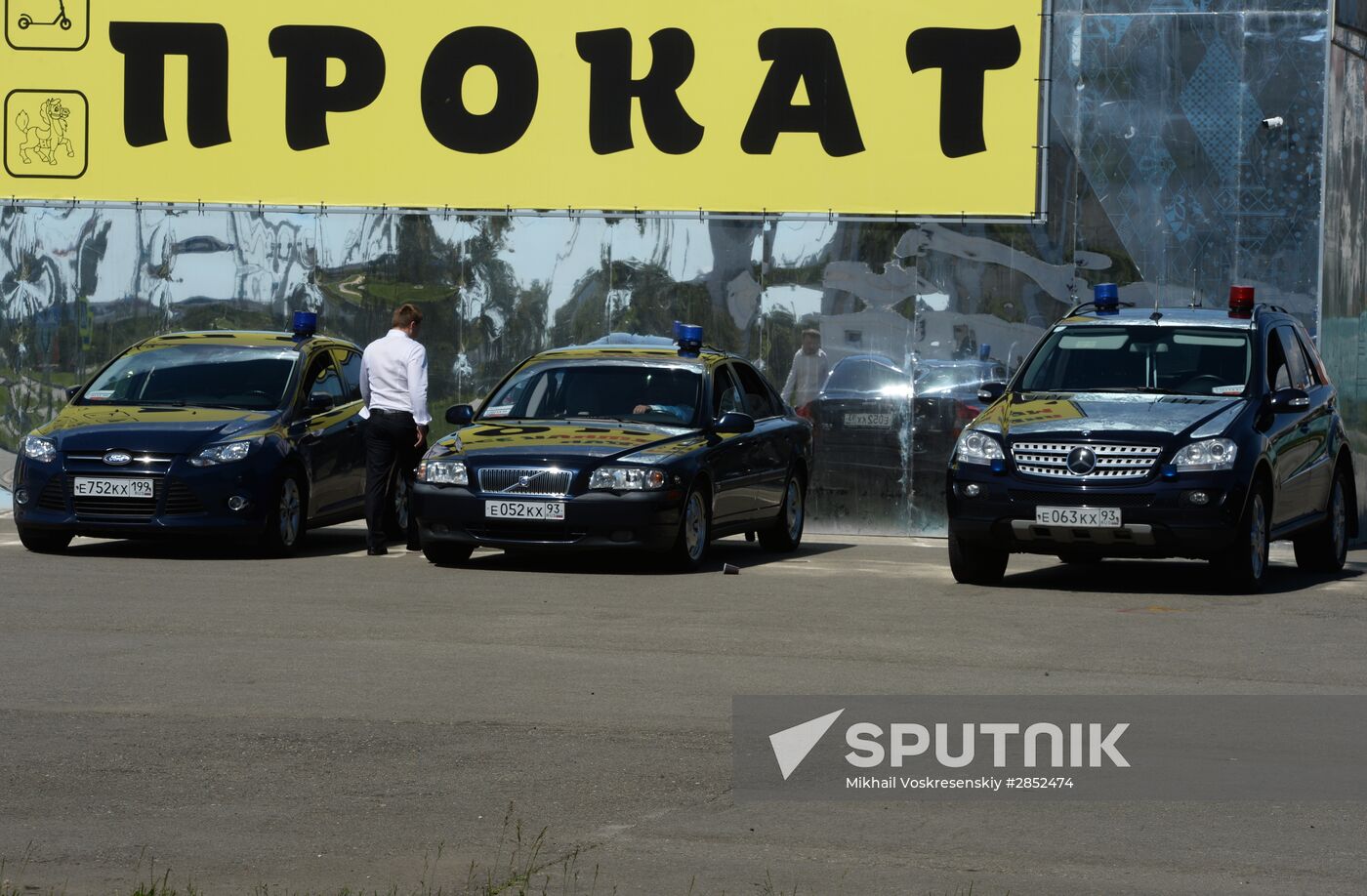 Cars with alarm light outside the congress center in Sochi
