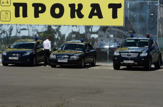 Cars with alarm light outside the congress center in Sochi