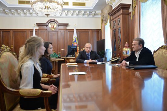 President Vladimir Putin meets with widows of journalists killed in Ukraine performing professional duty