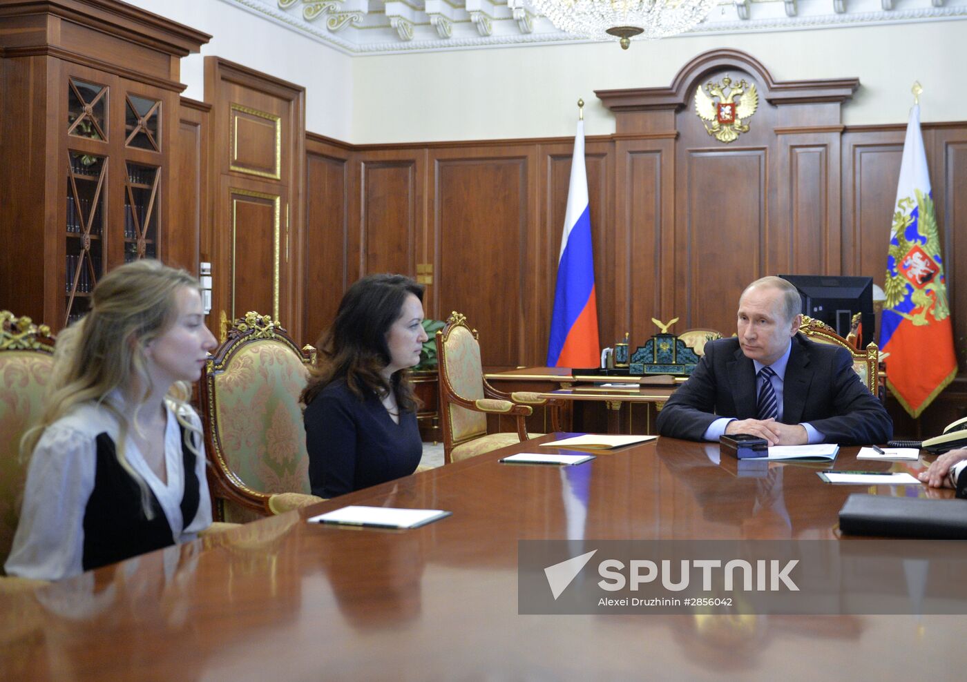 President Vladimir Putin meets with widows of journalists killed in Ukraine performing professional duty