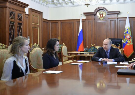 President Vladimir Putin meets with widows of journalists killed in Ukraine performing professional duty