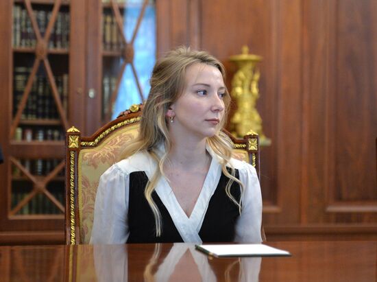 President Vladimir Putin meets with widows of journalists killed in Ukraine performing professional duty