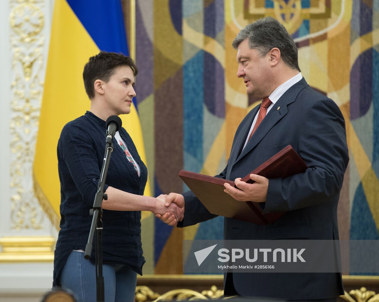 Ukrainian President Petro Poroshenko awards Nadezhda Savchenko the Order of Gold Star