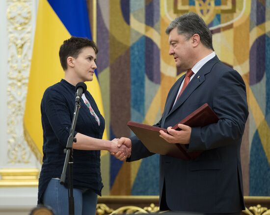 Ukrainian President Petro Poroshenko awards Nadezhda Savchenko the Order of Gold Star