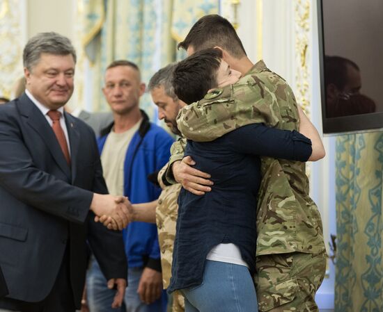 Ukrainian President Petro Poroshenko awards Nadezhda Savchenko the Order of Gold Star