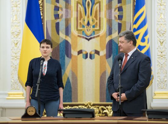 Ukrainian President Petro Poroshenko awards Nadezhda Savchenko the Order of Gold Star
