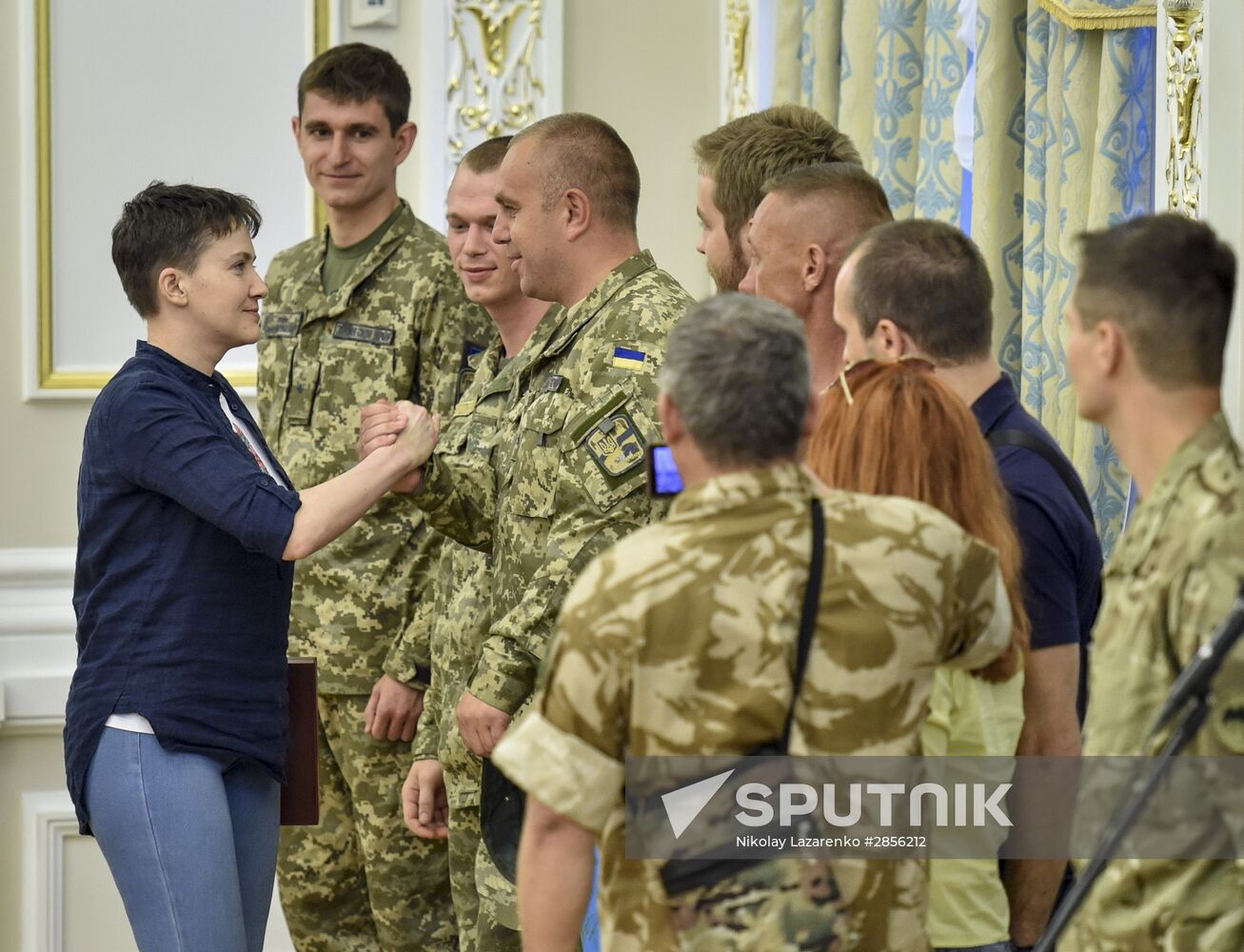 Ukrainian President Petro Poroshenko awards Nadezhda Savchenko the Order of Gold Star