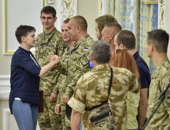Ukrainian President Petro Poroshenko awards Nadezhda Savchenko the Order of Gold Star