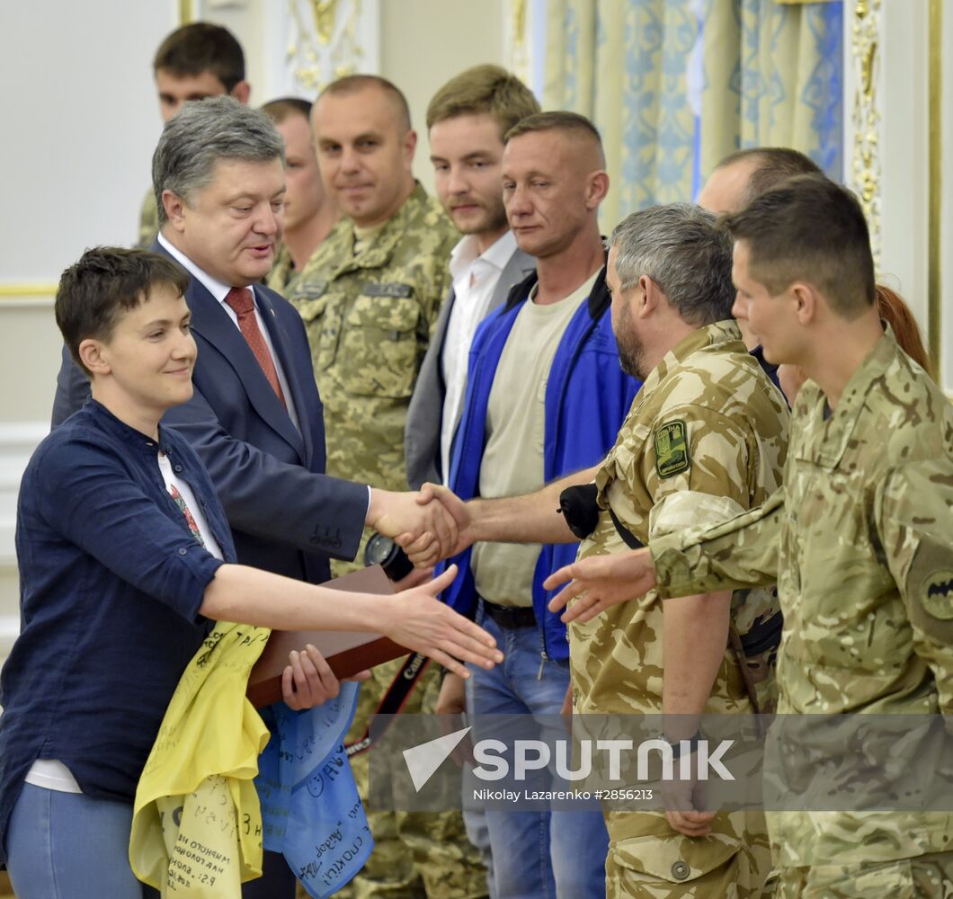 Ukrainian President Petro Poroshenko awards Nadezhda Savchenko the Order of Gold Star