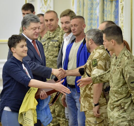 Ukrainian President Petro Poroshenko awards Nadezhda Savchenko the Order of Gold Star